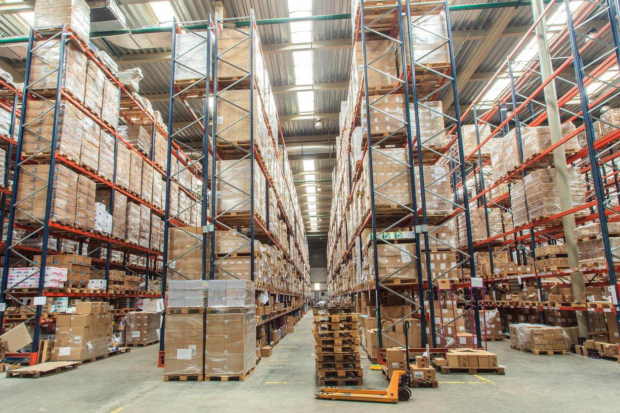 A warehouse filled with lots of boxes and shelves.